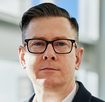 ภาพพอร์ตเทรตของ Alexander Hughes CEO ของบริษัทซื้อขายคริปโตและผู้บริหาร